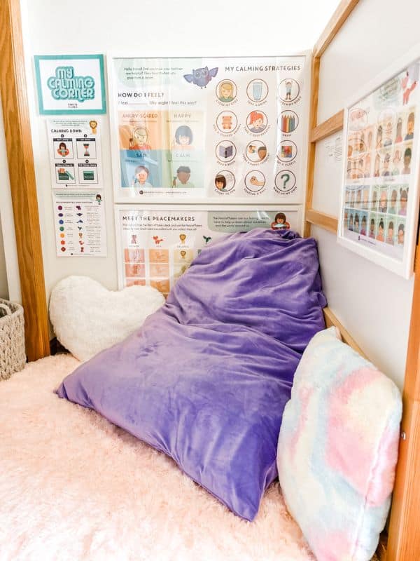 Colorful calming corner with soft pillows and rug.