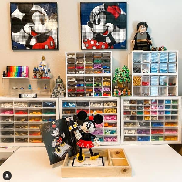 A well-organized Lego room with small drawers labeled and filled with different types of Lego pieces and accessories.